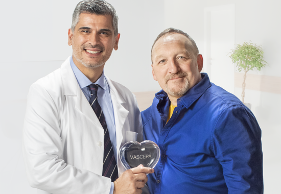 Doctor hold the clear VASCEPA® (icosapent ethyl) heart with his patient